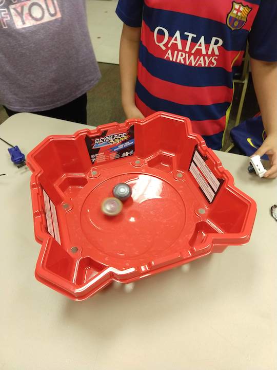 Beyblade battle between boys