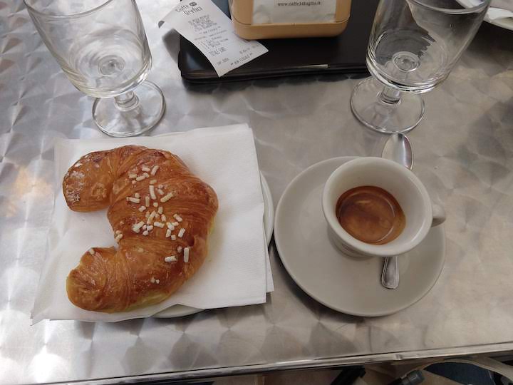 Image of croissant and espresso